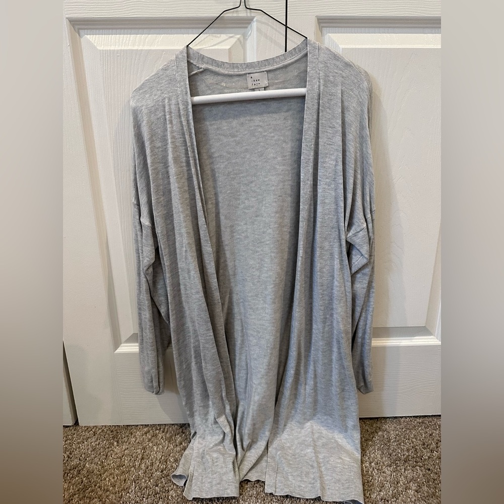 Women’s gray sweater in a Large.